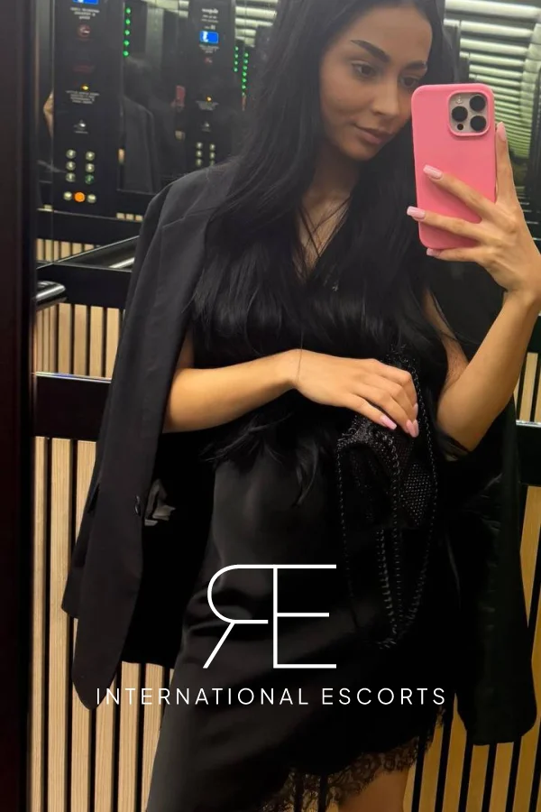 Dasha is taking a selfie in a lift