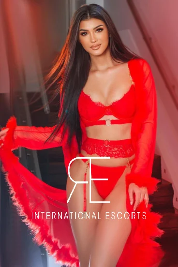 A very sexy London escort dressed all in red 