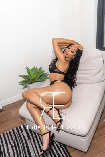 A sexy ebony London escort wearing high heels and sexy underwear 