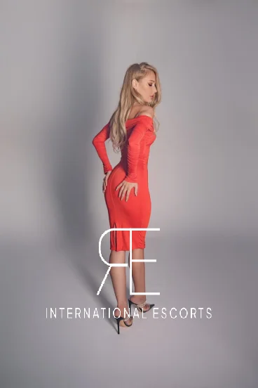 Sexy blonde wearing a red dress 