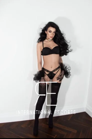 A very sexy female London escort is pictured in sexy black fluffy underwear 
