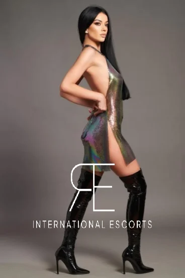 Slim elite London escort Demi is wearing a very sexy dress 