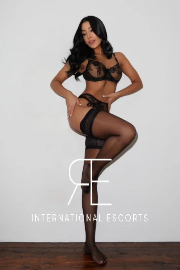 A Brazilian London escort wearing black sexy lingerie 