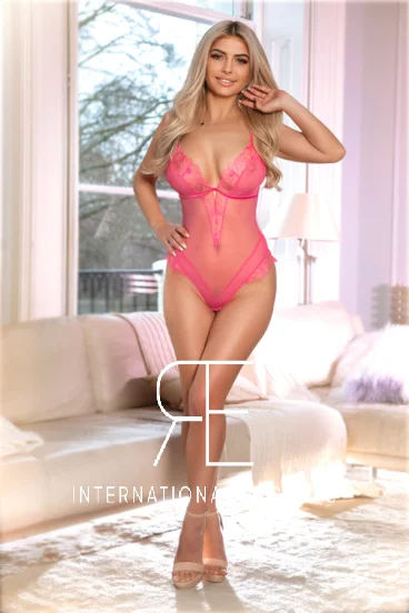 London escort Jolene looks very sexy in this pink lace body 
