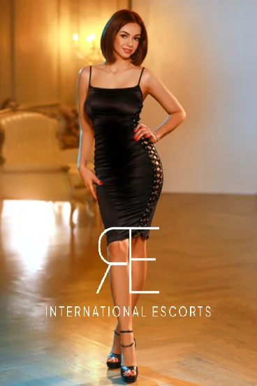 London escort lady dressed in a black dress and heels 