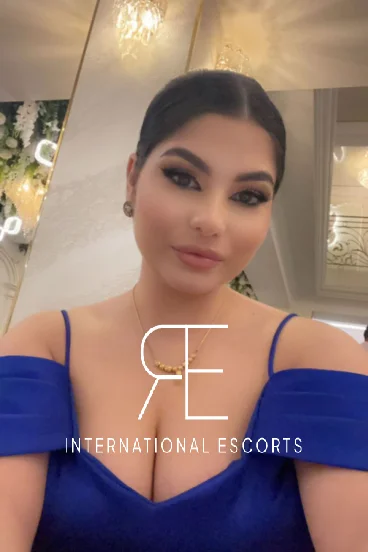 In this selfie Star is wearing a blue dress 