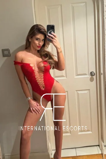 Sexy high class London escort Chardonnay is wearing red 