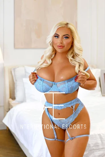 Busty blonde Adeila looks very sexy wearing this blue lace lingerie set 