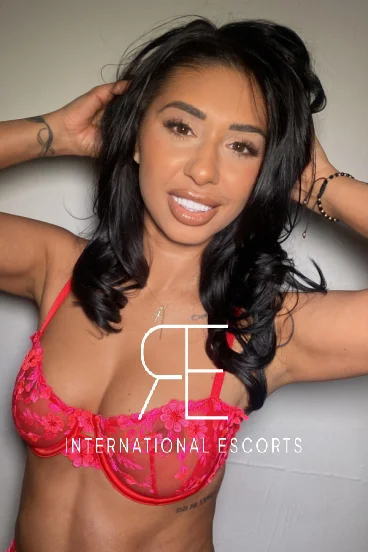 Brunette escort Snow is wearing a pink bra in this selfie 