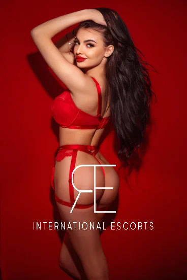 Sexy London escort wearing red lingerie 