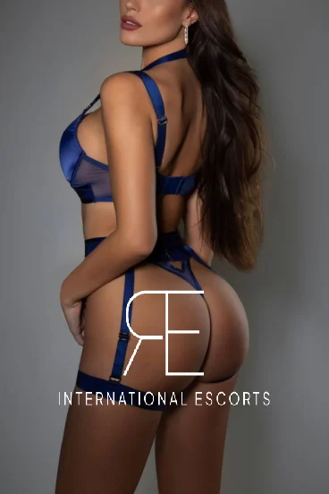 Rose looks very sexy dressed in blue lingerie 