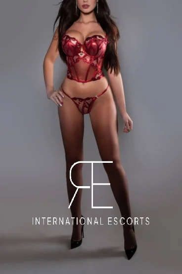 London escort with red lips and dressed in sexy red lingerie 