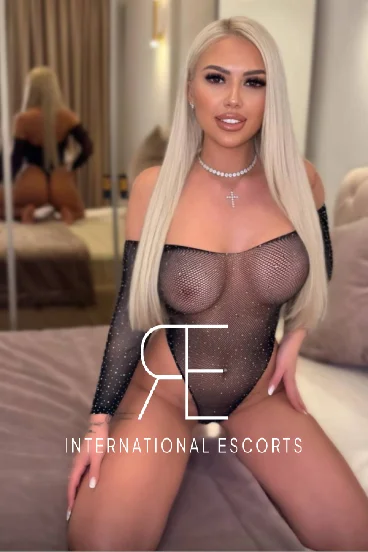 Blonde lady wearing a see through basque 