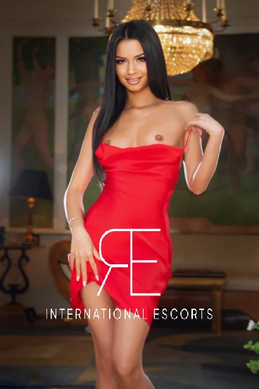 London escort Tarina wearing a red dress 