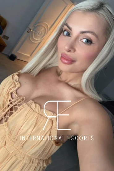 Shelby is looking very sexy wearing a low cut gold dress 