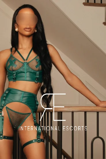 Asha has a green mesh bra on that shows off her nipples 