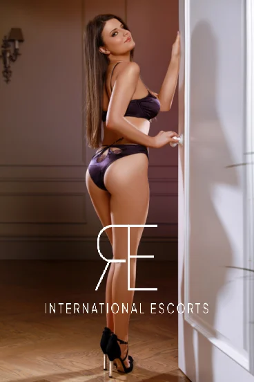 Slim sexy brunette lady wearing black lingerie 