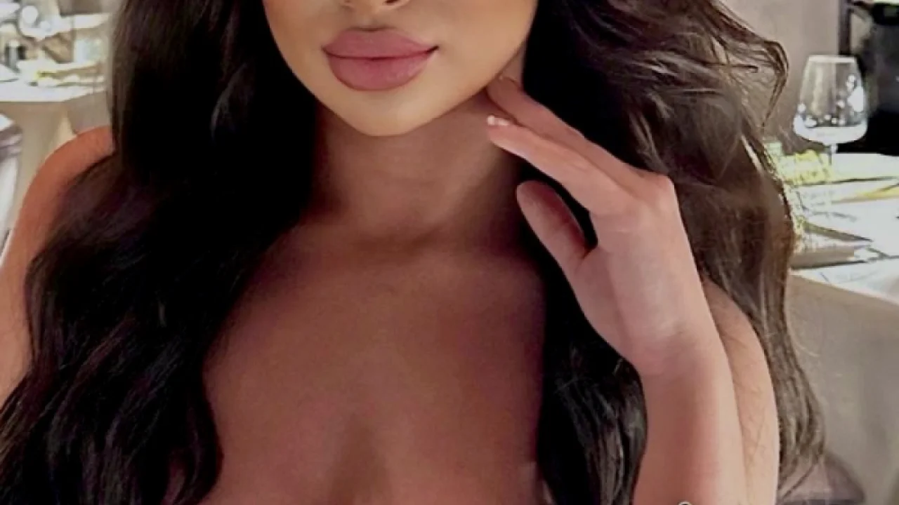 Sexy busty lady wearing a low cut dress 