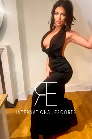 Elite British porn star Sierra Rose wearing a black dress 