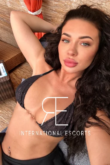 Sexy brunette lady wearing a black bikini 