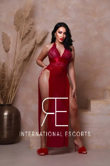 London escort wearing a sexy red dress 