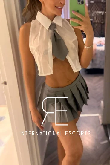 A slim sexy blonde London escort taking a selfie 