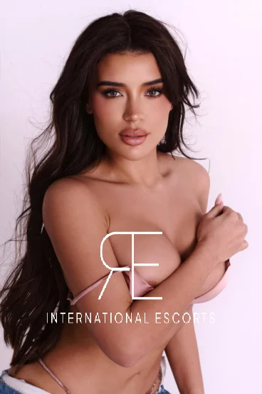 Tornia showcases her British charm in a blush-pink bikini, gaze set to mesmerise.