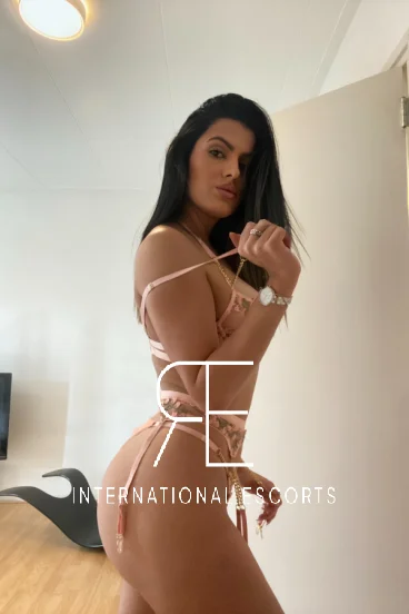 Cleo in peach lingerie, luxury Brazilian companion abroad