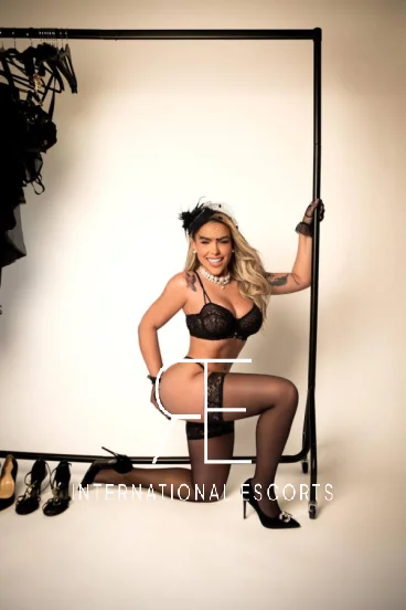 Lainey crawling seductively in black lingerie and heels