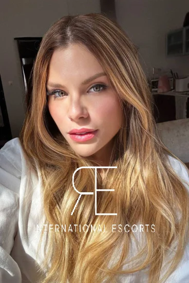 Blonde London escort Tallie taking a very close up selfie to show off her flawless skin 