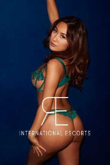 Autum, cosmopolitan Asian beauty in green lingerie, international elite escort.