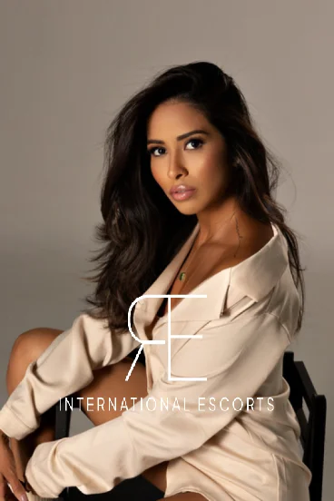 Clemmie portrait in silk shirt, sophisticated London escort