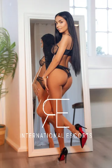 Rear view in lingerie with reflection, toned and confident.