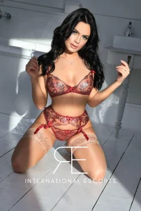 A profile picture of a sexy brunette London escort named Blossom