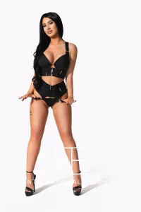 London escort  in black lingerie, full body pose