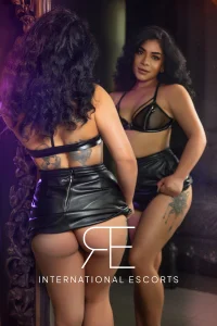 International beauty Lacey in leather lingerie, cosmopolitan and daring